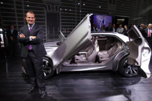 Yves Bonnefont, CEO of DS brand, poses next to the Divine DS concept car on media day at the Paris